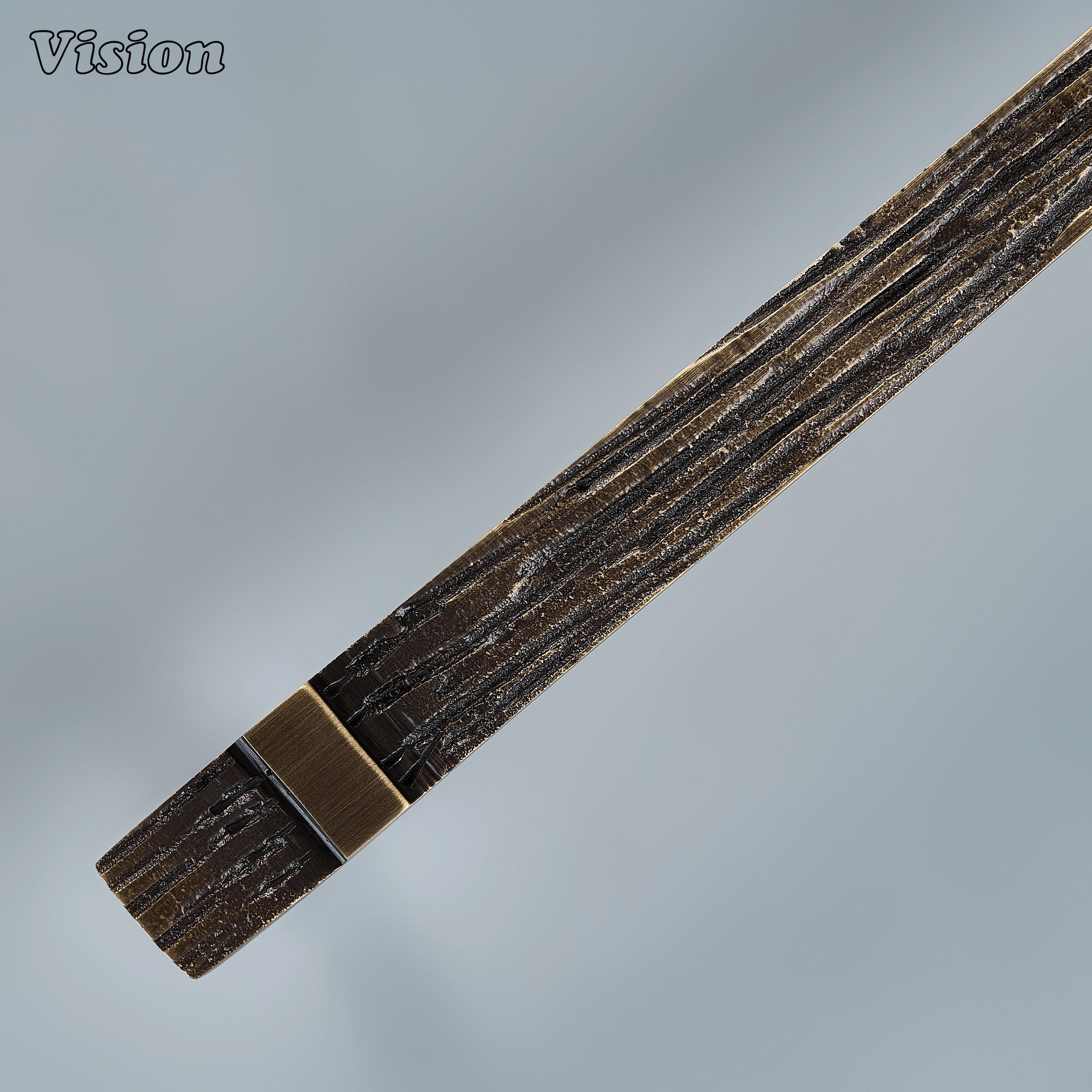 Antique bronze artisanal cabinet handle with tactile carved surface for custom joinery