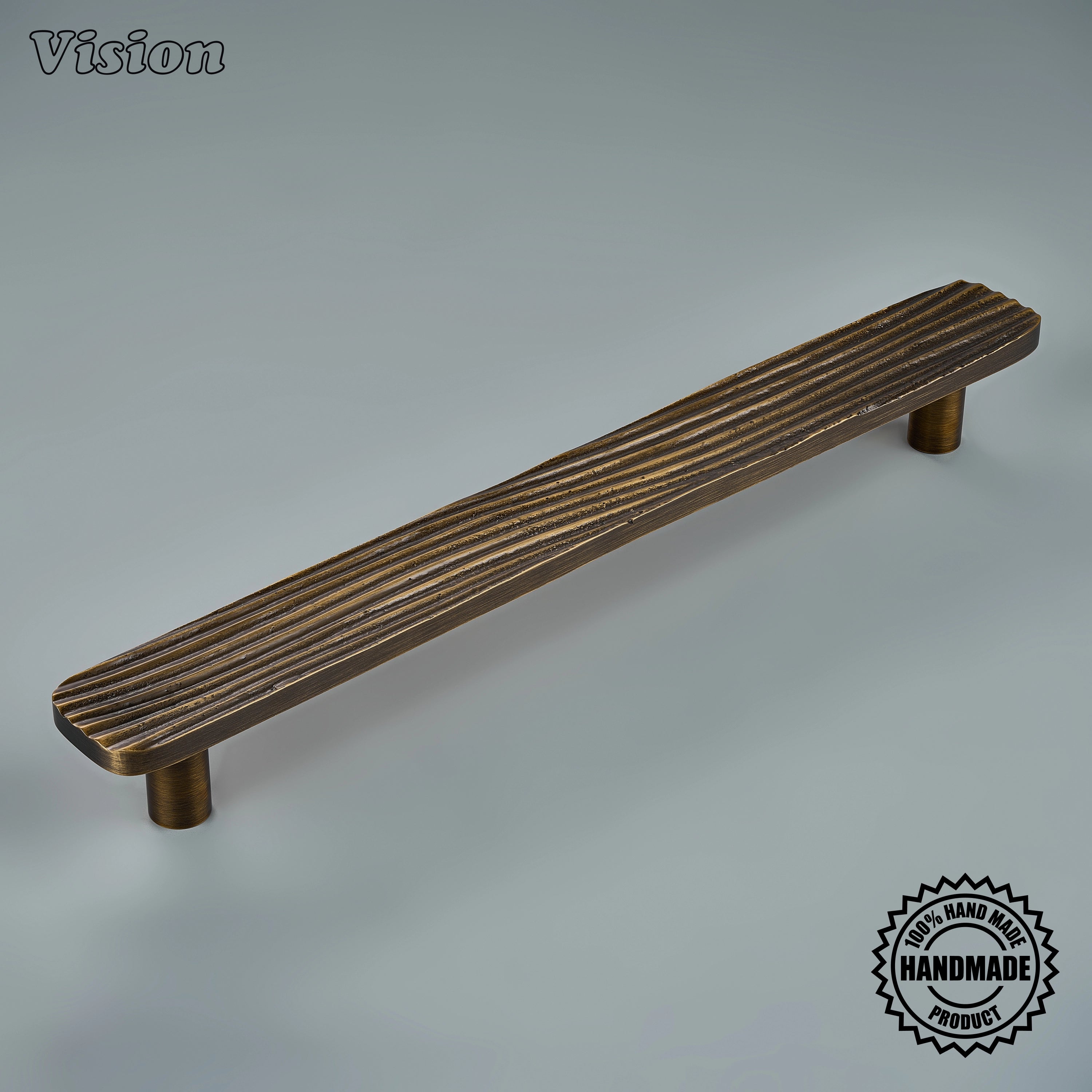 Antique Bronze handcrafted appliance pull with flowing ridged texture on tall custom pantry doors