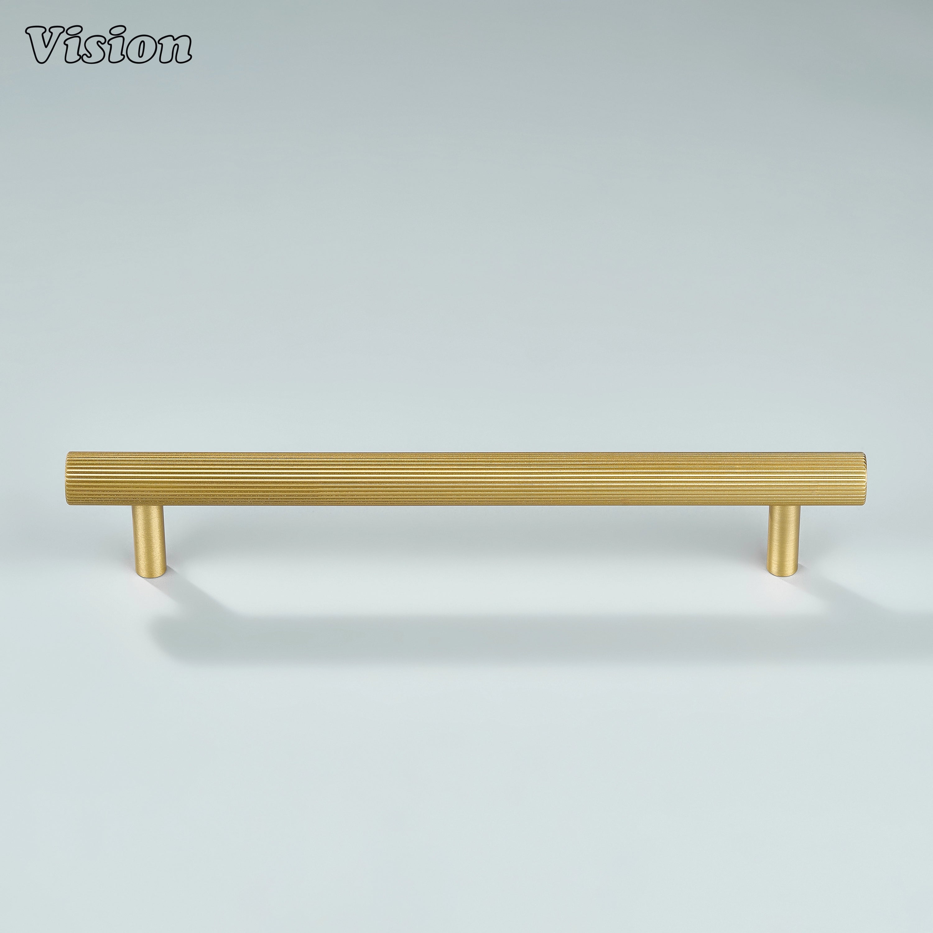 Gold linear knurled cabinet pull installed on bathroom vanity cabinets.