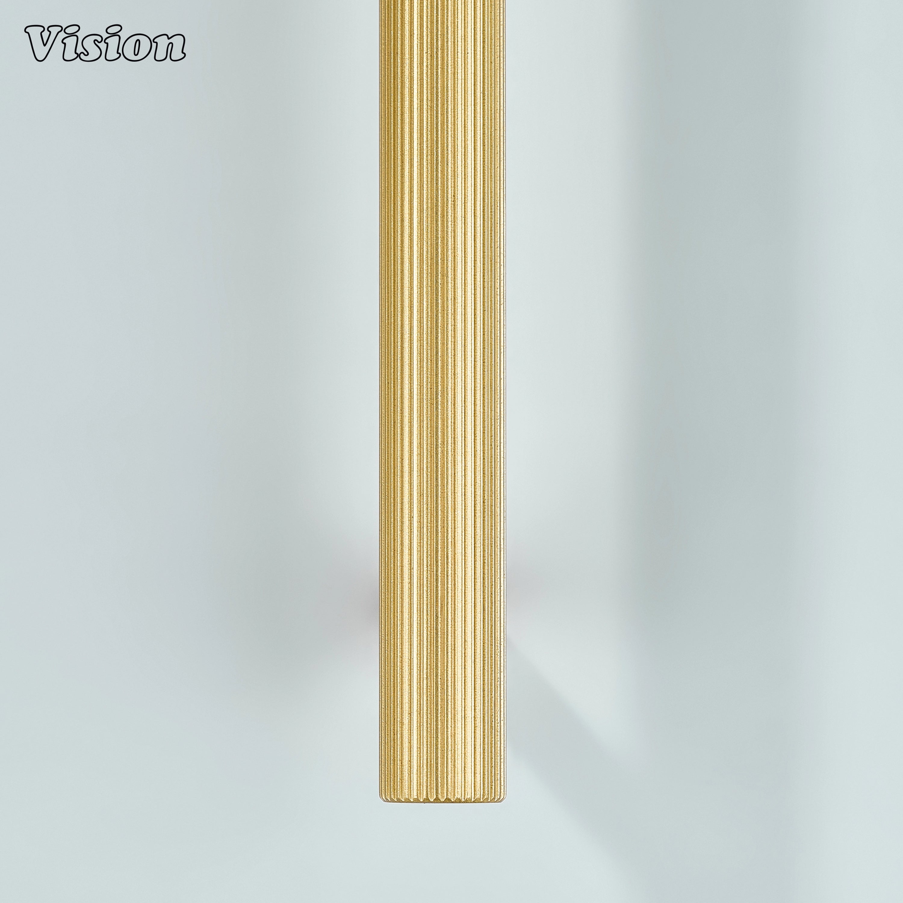 Gold linear knurled handle with brass finish used for furniture drawers.