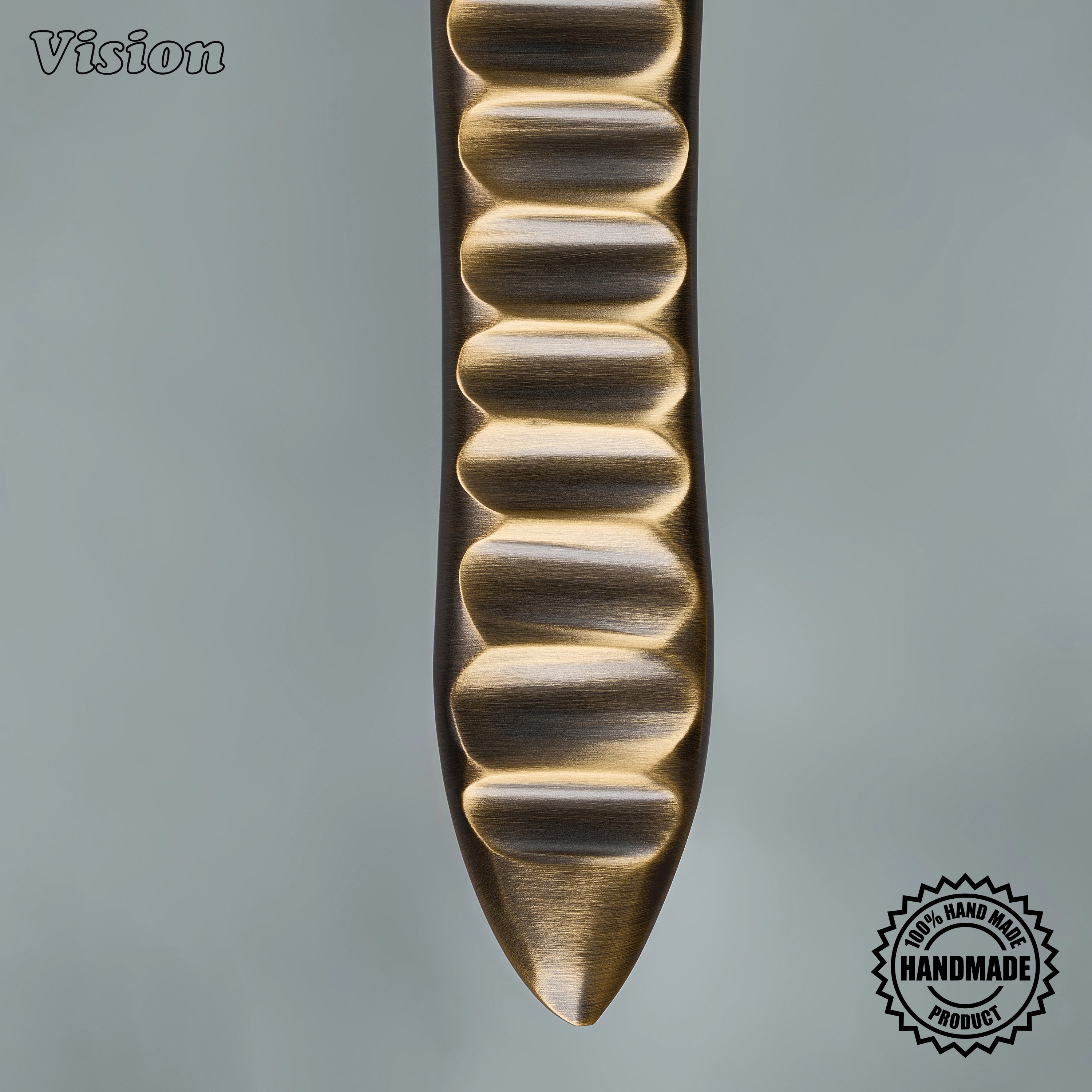 Antique Bronze premium appliance handle with organic sculpted surface for oversized kitchen cabinets.