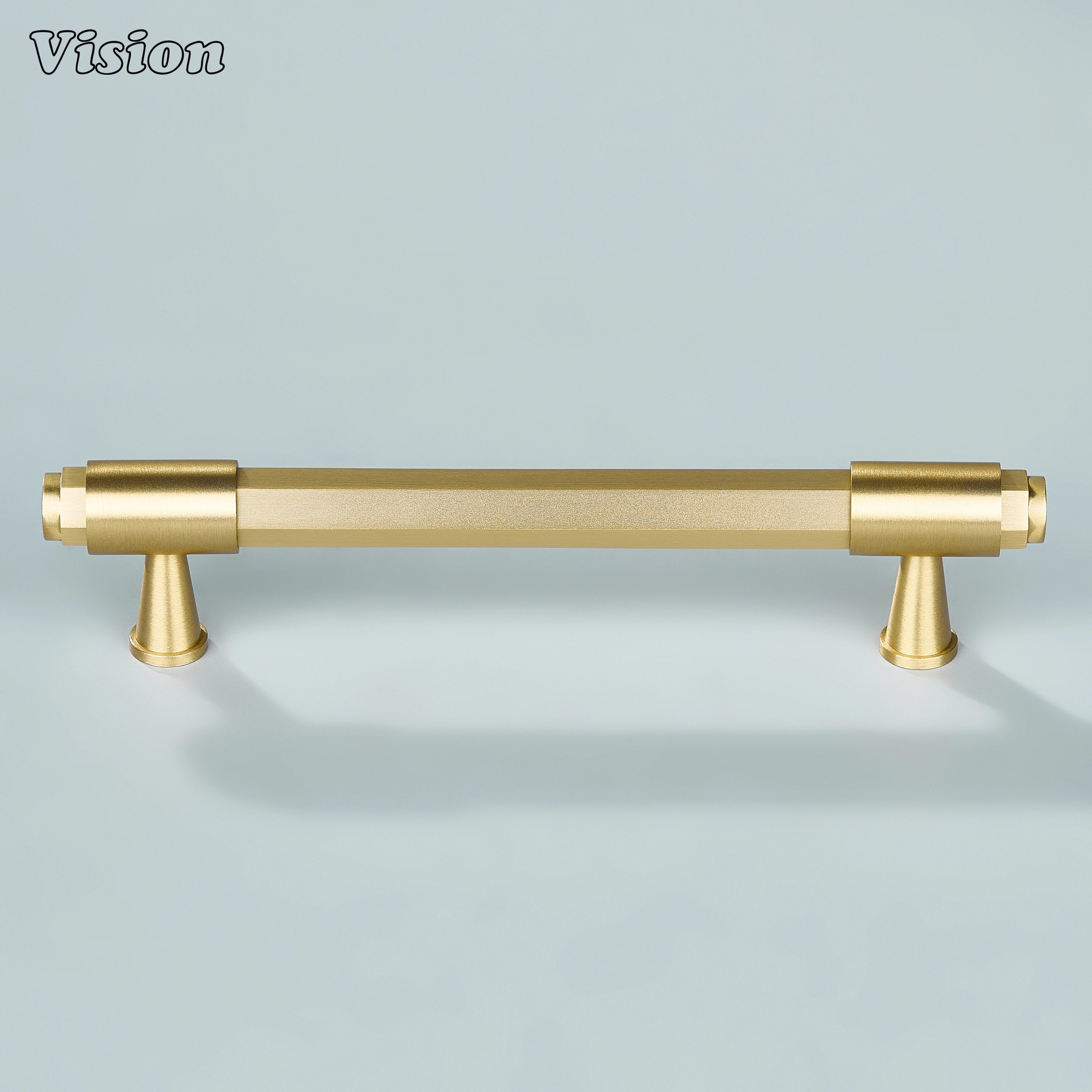 Gold hexagonal cabinet handle with circular extruded end details and elegant cone supports for kitchen drawers