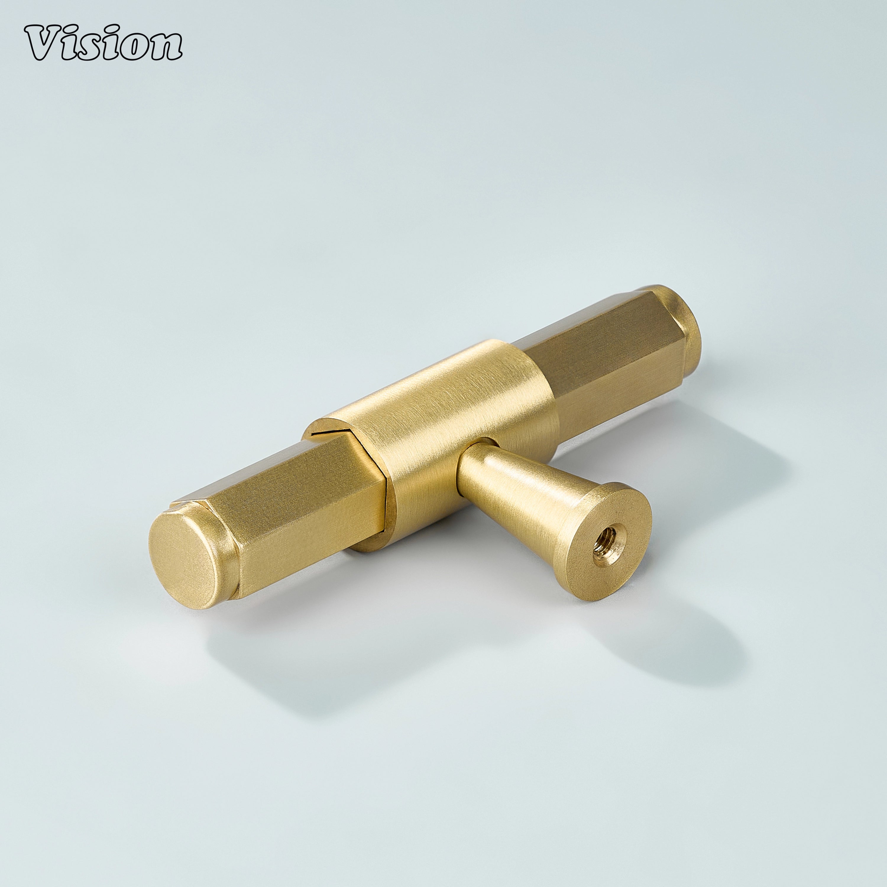 Gold T-knob with hexagonal profile, circular center mount and ring accent base for furniture drawers