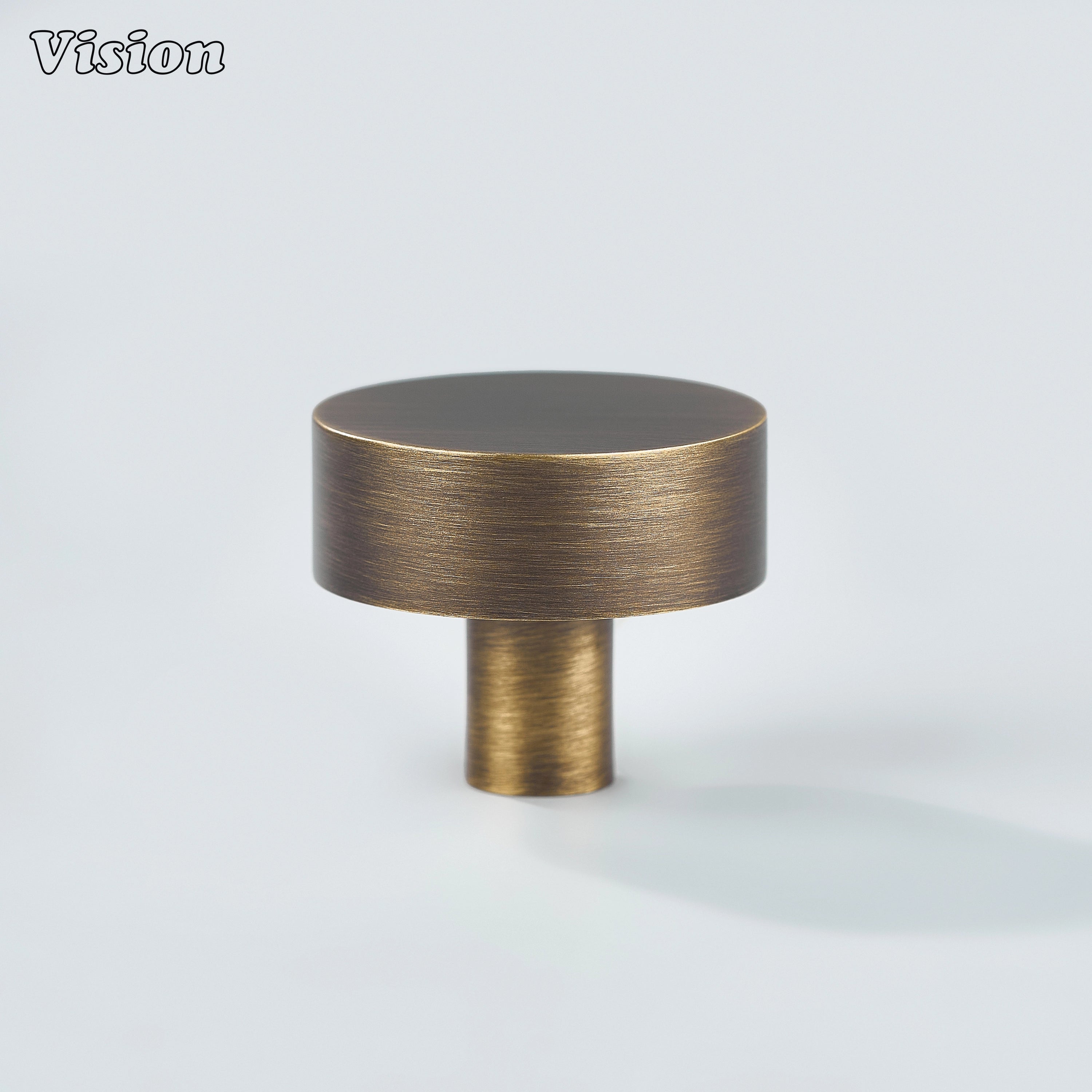Antique Bronze round cabinet knob featuring smooth circular design for wardrobes