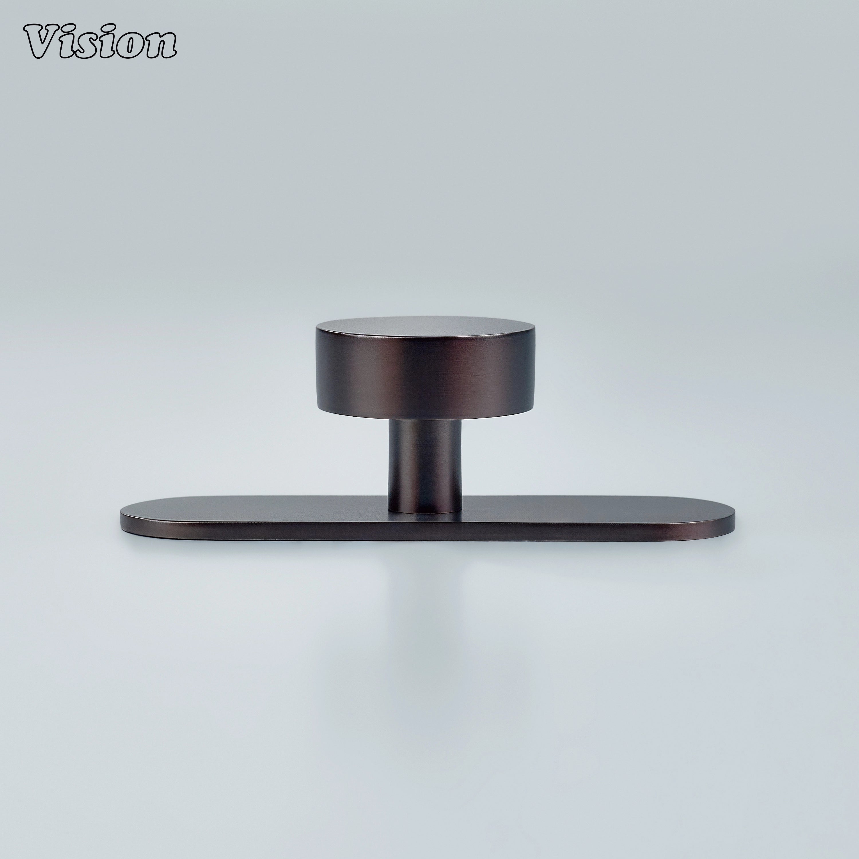 Round cabinet knob mounted on backplate in Oil Rubbed Bronze for wardrobe drawers