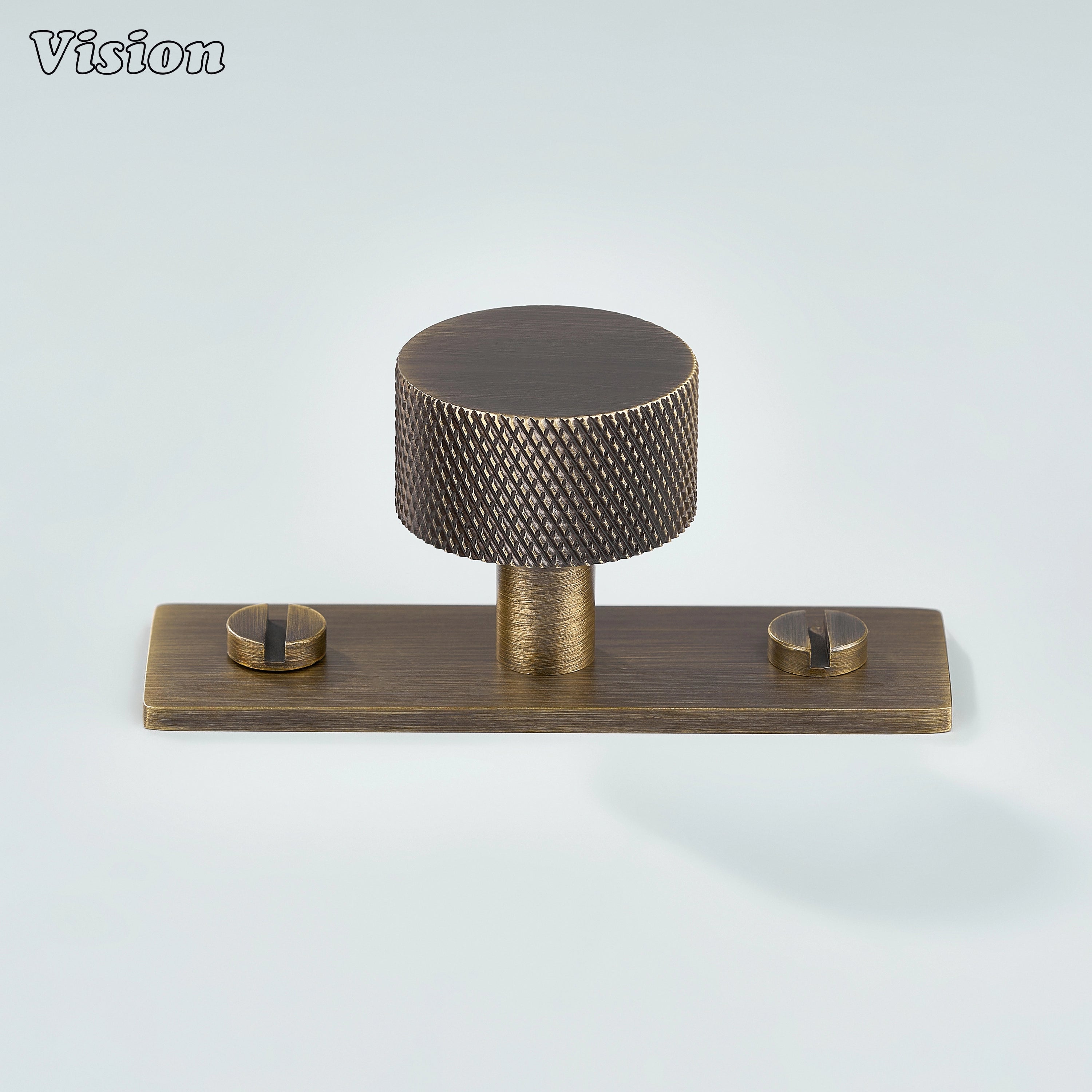 Antique Bronze knurled cabinet knob mounted on backplate for kitchen cabinets