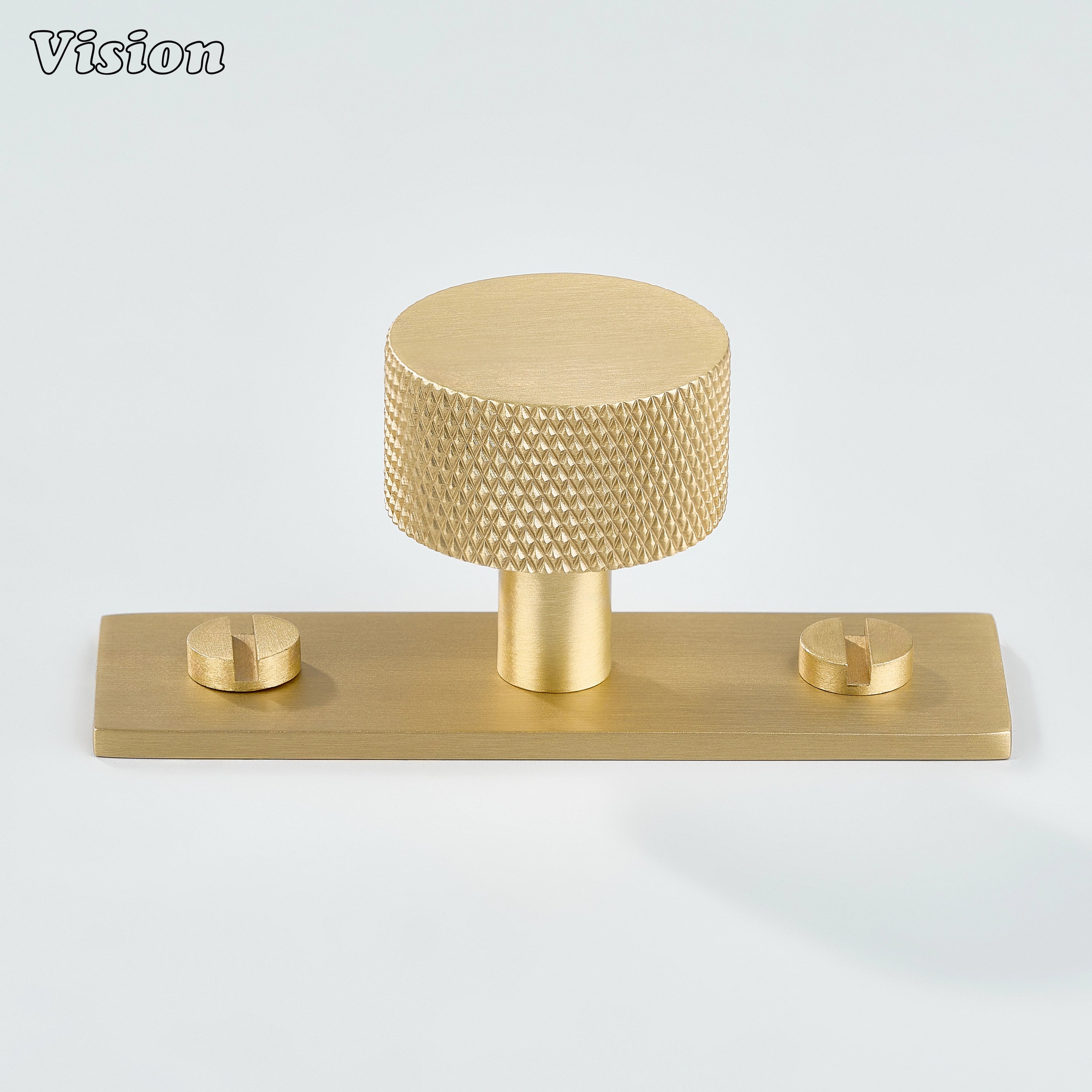 Gold round knurled cabinet knob on rectangular backplate for wardrobe furniture