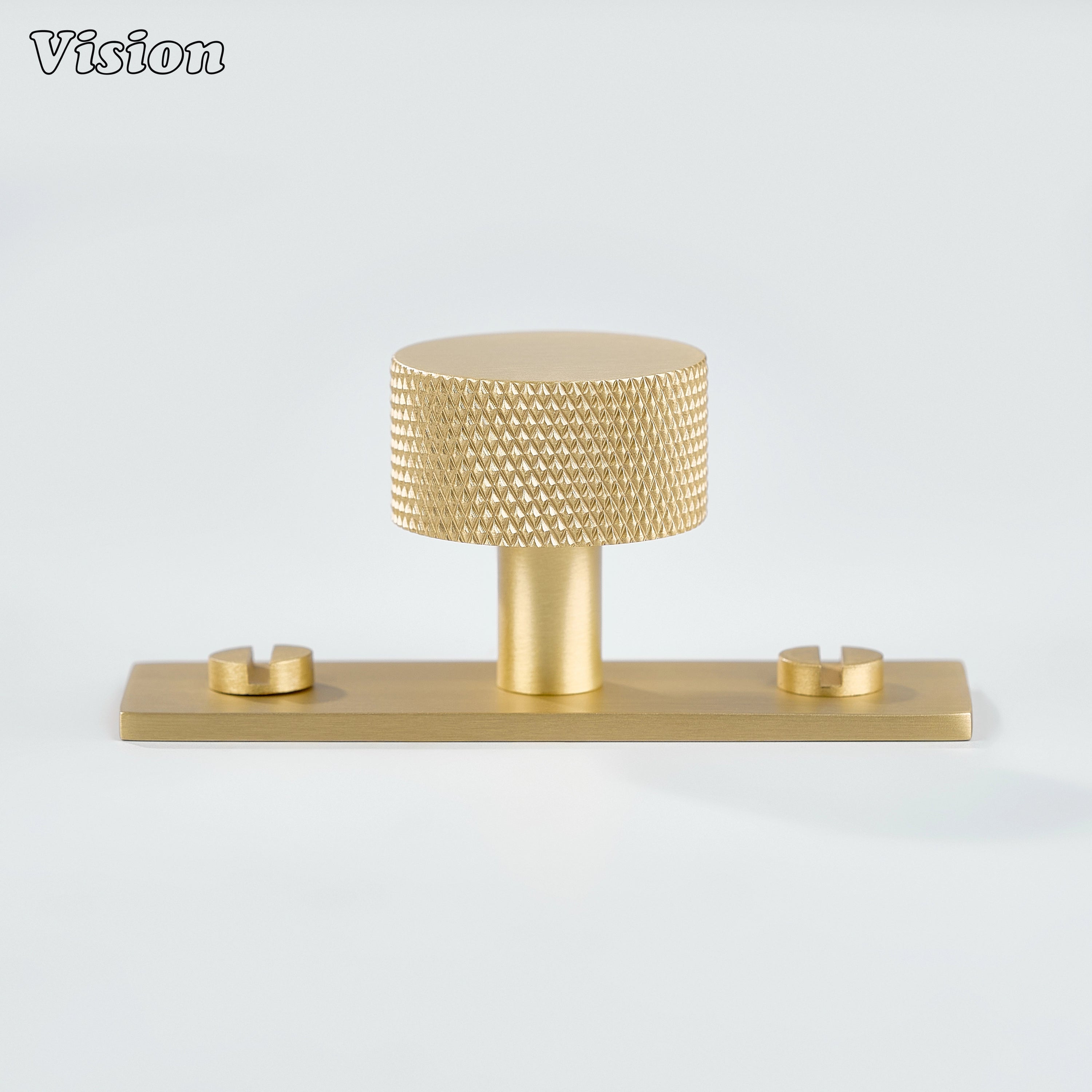 Gold knurled cabinet knob mounted on backplate for kitchen drawer applications