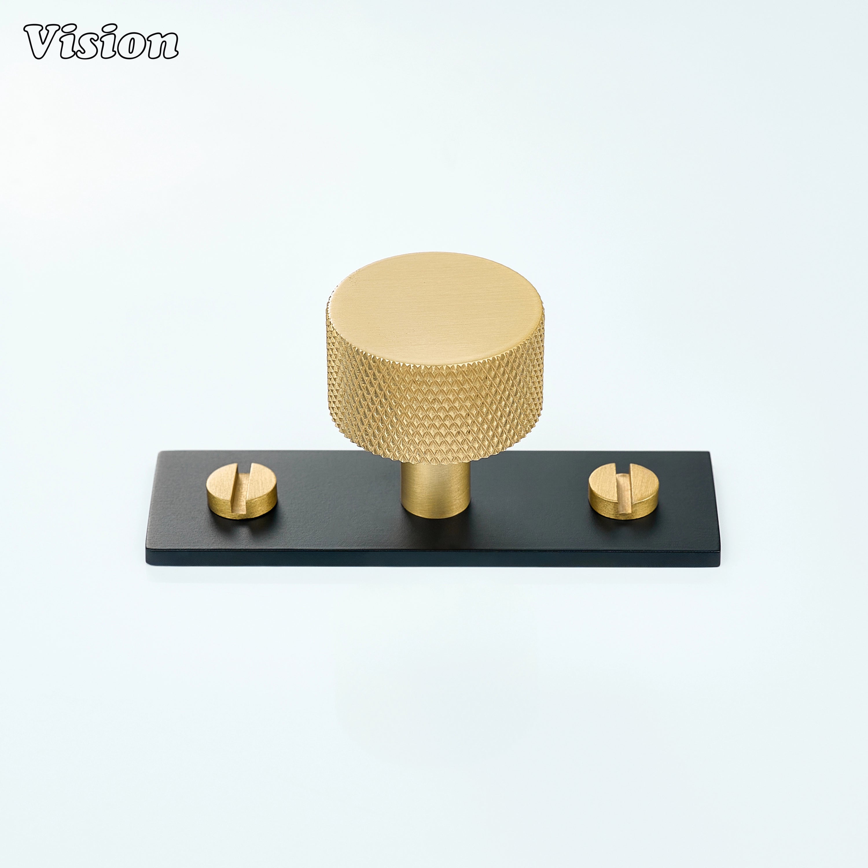 Gold and Black knurled cabinet knob mounted on backplate for kitchen drawer applications