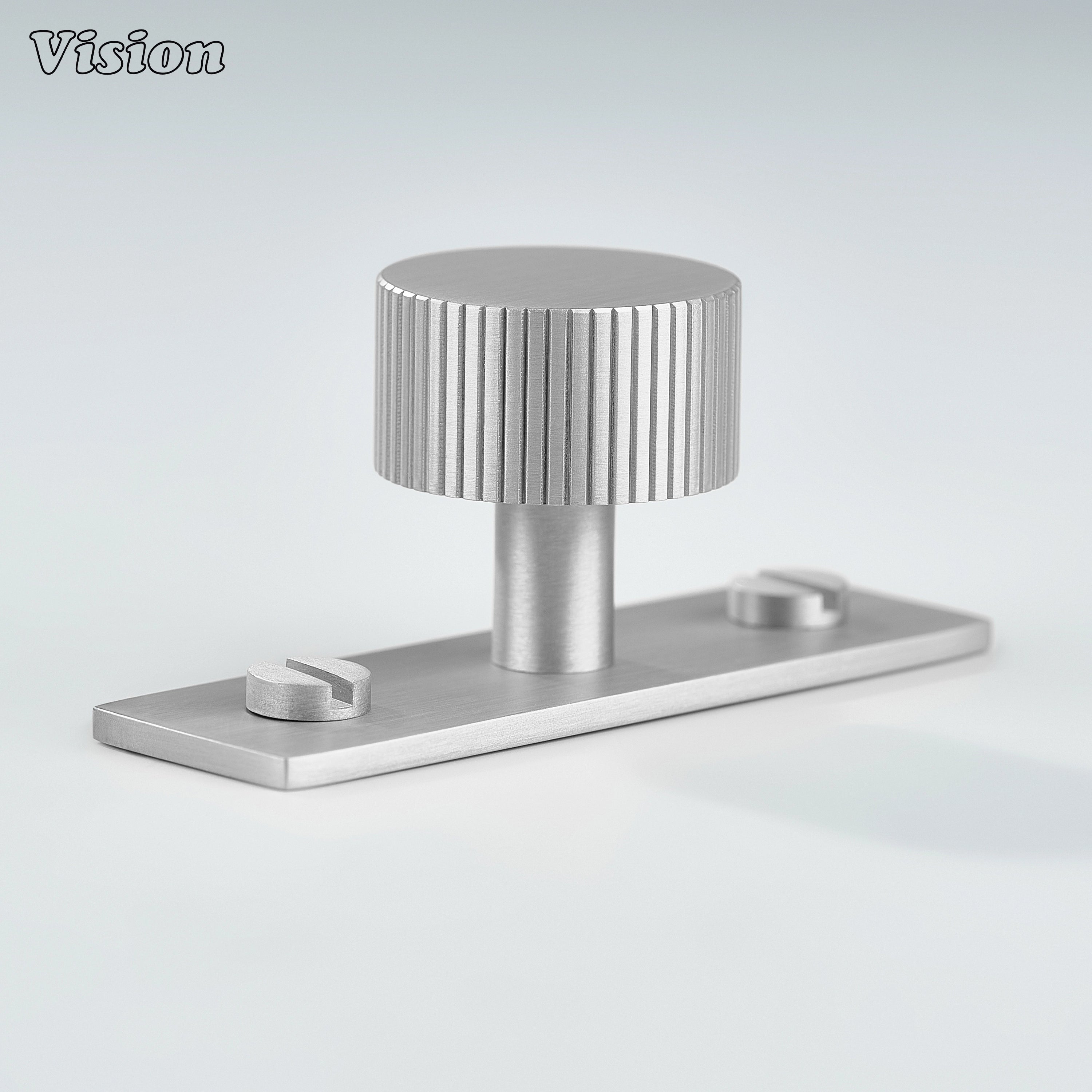 Silver cabinet knob with knurled round design on backplate for drawers