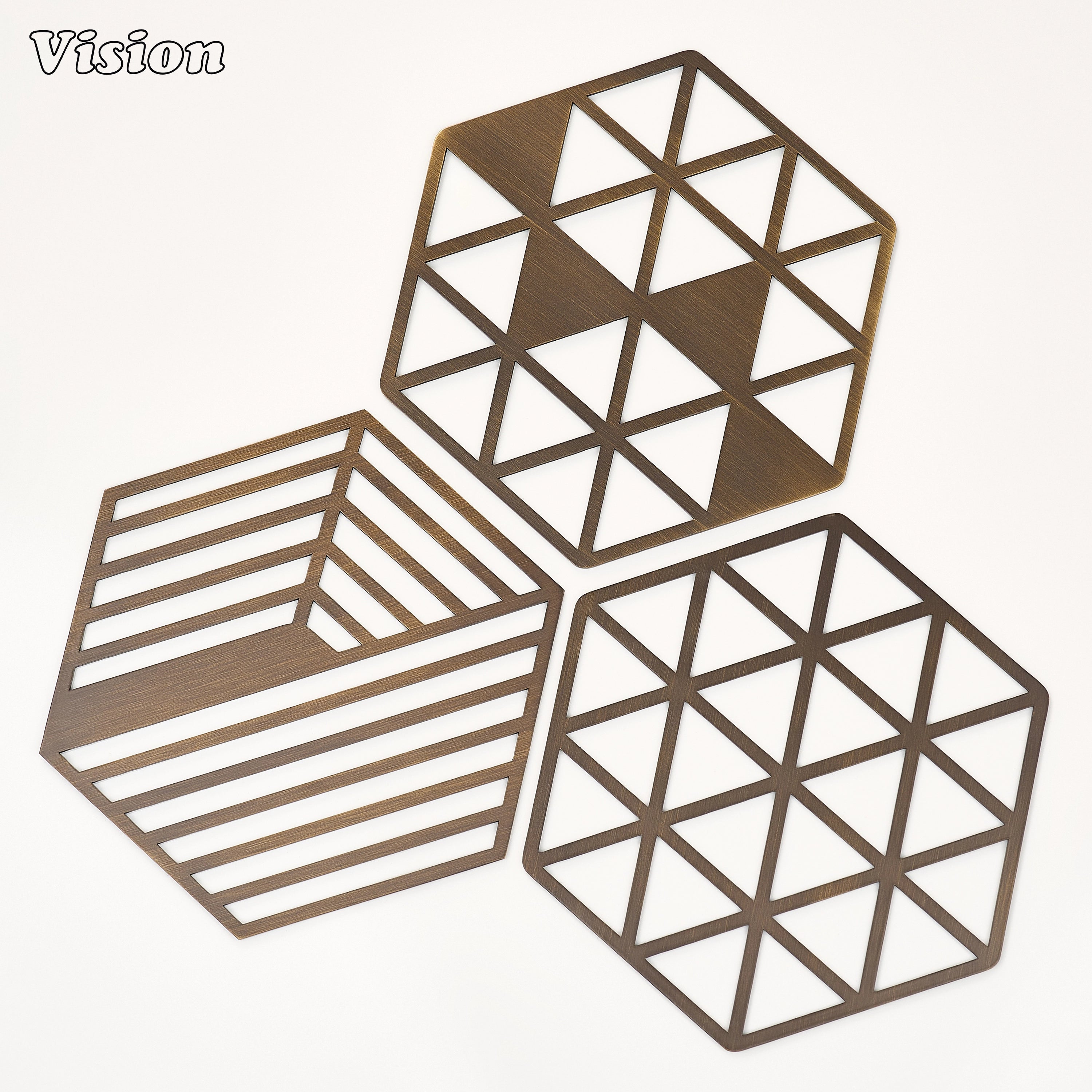 Premium antique bronze geometric brass coaster with sharp directional cuts on a marble coffee table
