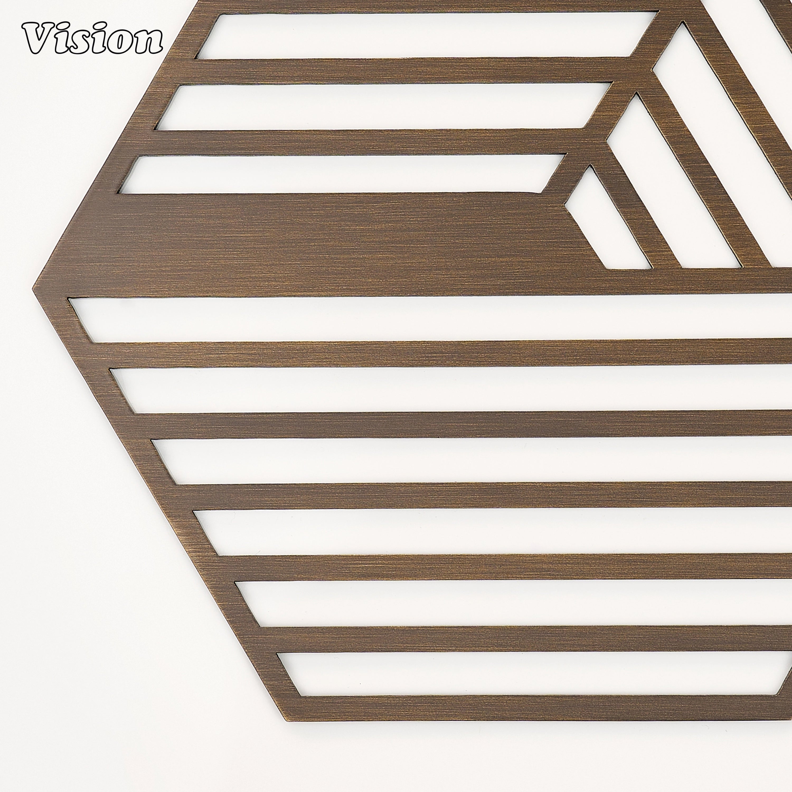 Heavy antique bronze solid brass drink coaster with dynamic striped cutouts on an office desk