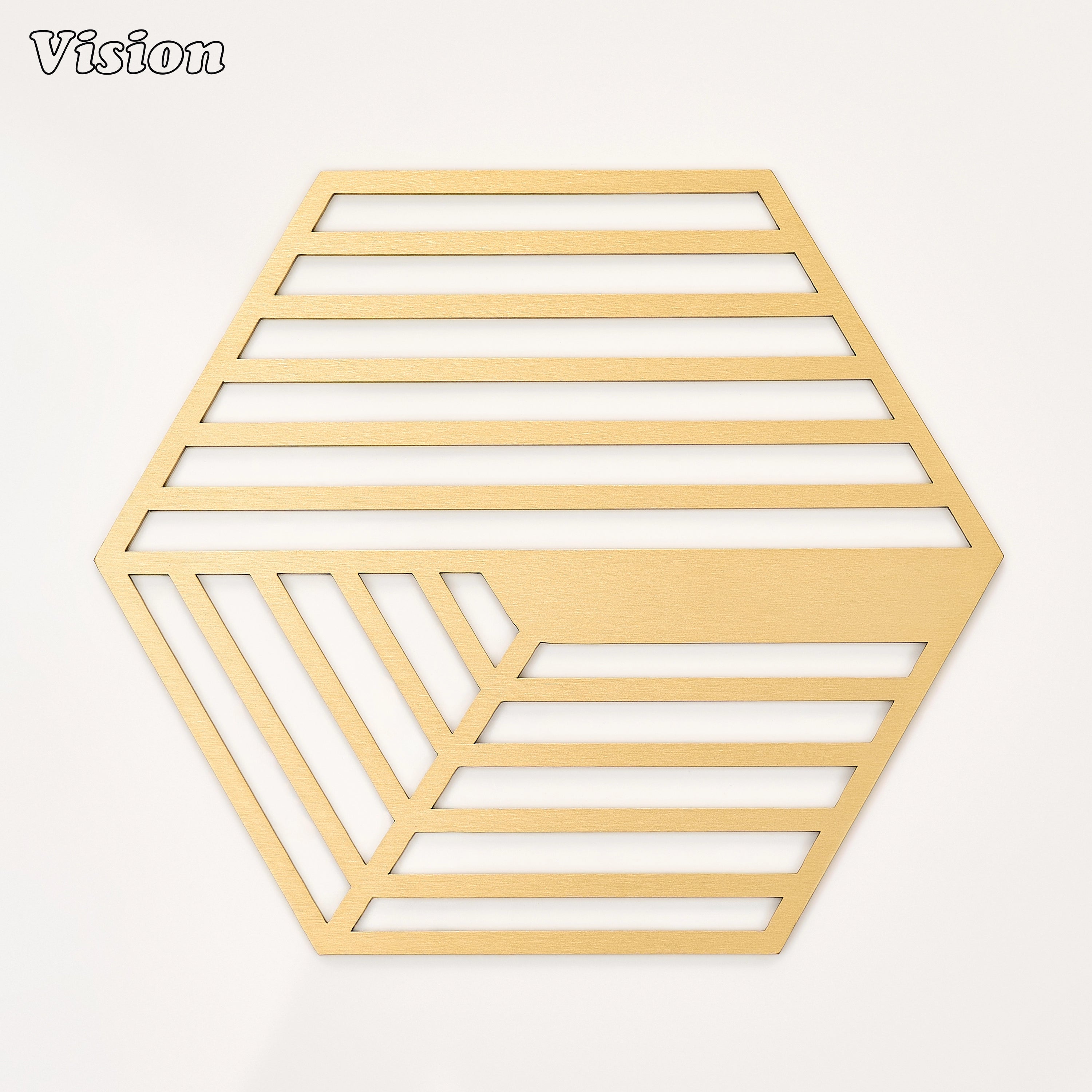 Gold solid brass hexagon coaster with intersecting parallel lines on a modern dining table