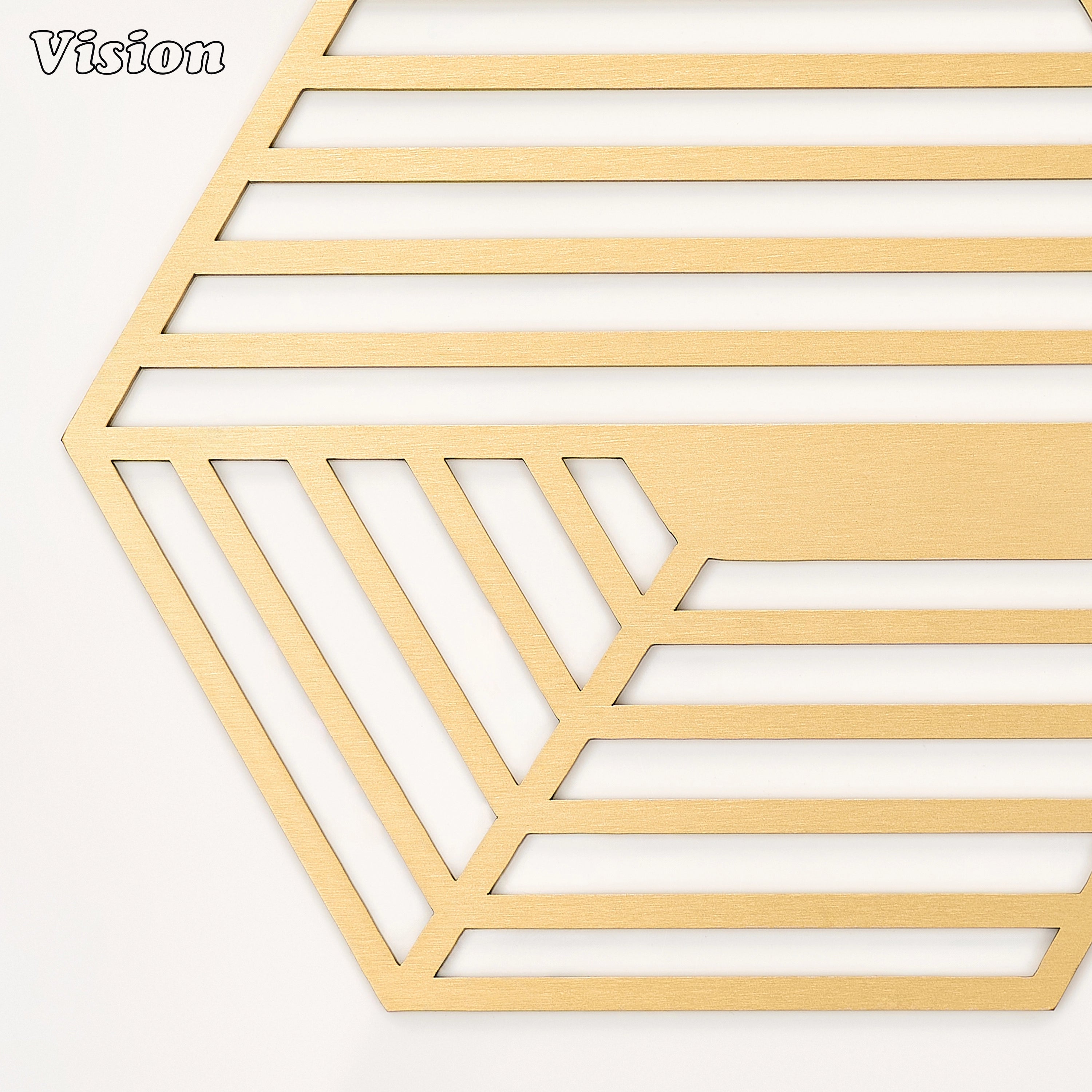 Heavy gold solid brass drink coaster with dynamic striped cutouts on a contemporary office desk
